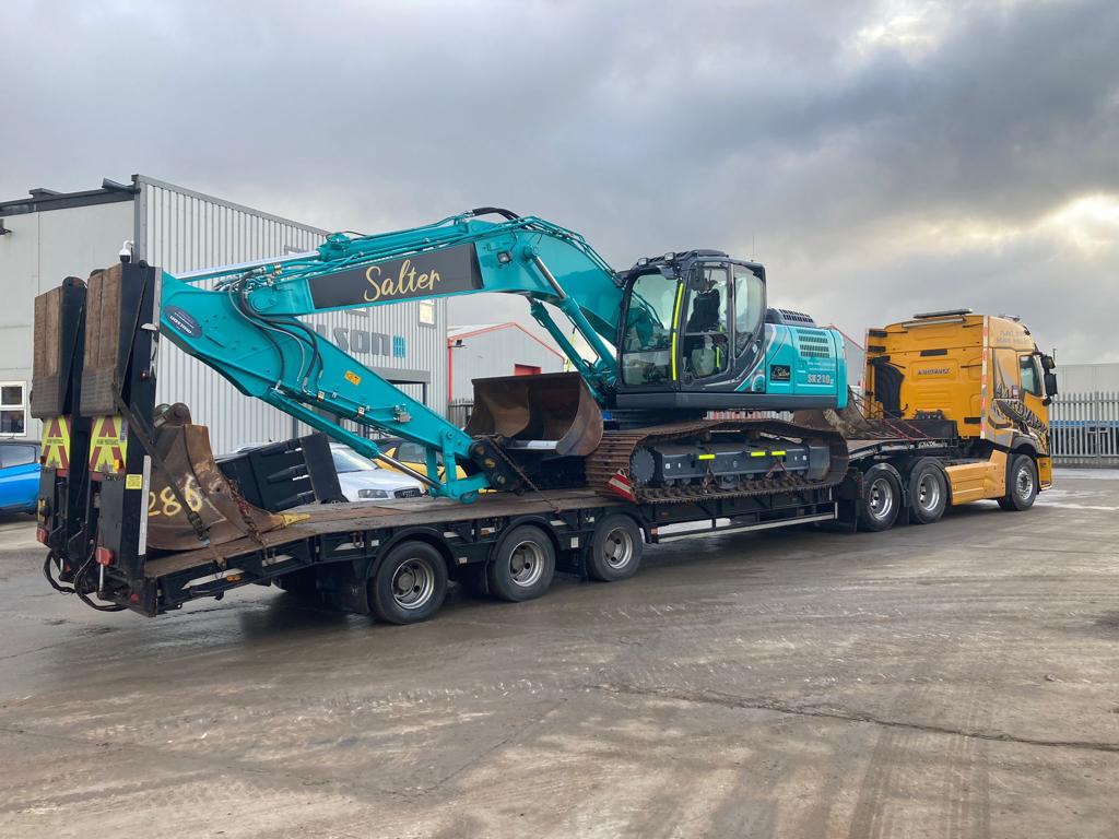 large plant hire vehicle being transported